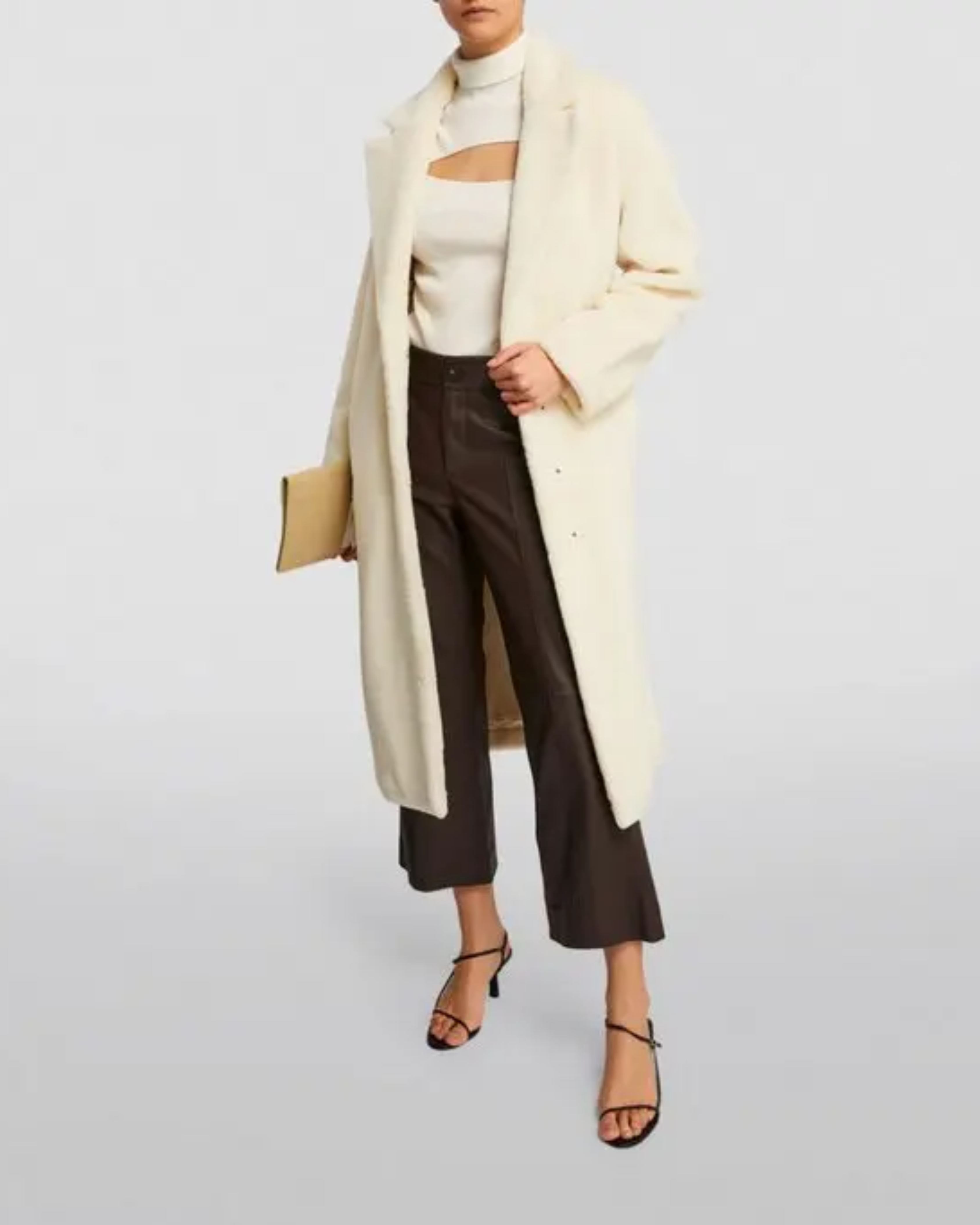 Cream faux fur long coat styled with cream cutout top, black cropped pants and black heels — Anine Bing | Endless UAE