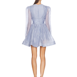 Woman wearing lavender Eden Dress by Zimmerman with tie-front detail and pleated skirt — Zimmerman | Endless UAE