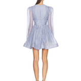 Woman wearing lavender Eden Dress by Zimmerman with tie-front detail and pleated skirt — Zimmerman | Endless UAE