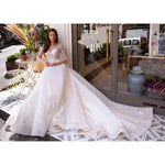 Elegant white wedding dress with beaded lace bodice and flowing ball gown skirt — Mar©a Anette | Endless UAE