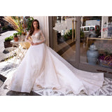 Elegant white wedding dress with beaded lace bodice and flowing ball gown skirt — Mar©a Anette | Endless UAE