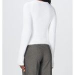 Rear view of model wearing white fluffy knit sweater with gray trousers — Coperni | Endless UAE