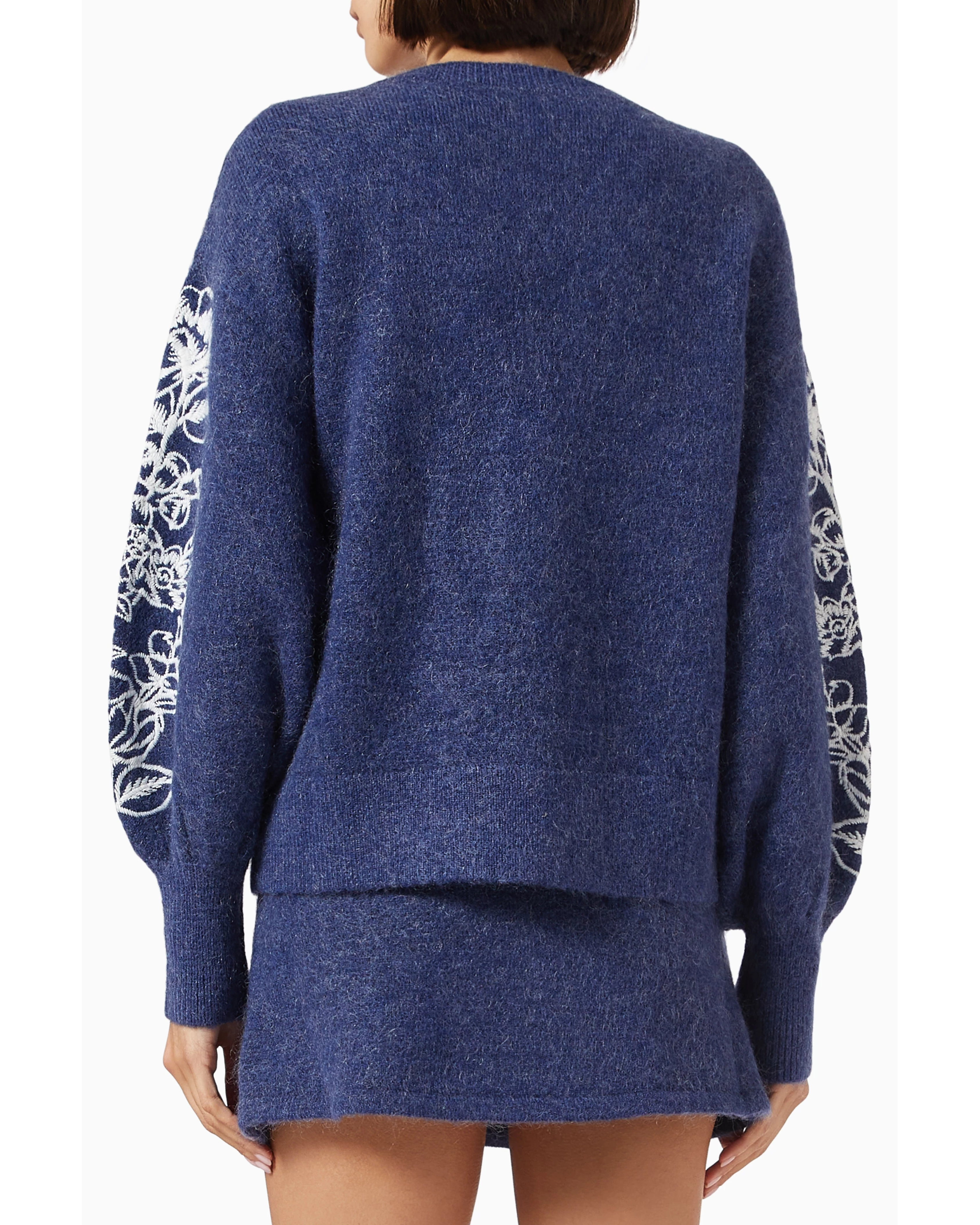 Navy blue knit cardigan with white floral embroidery on sleeves, relaxed fit, back view — Aston Studio | Endless UAE
