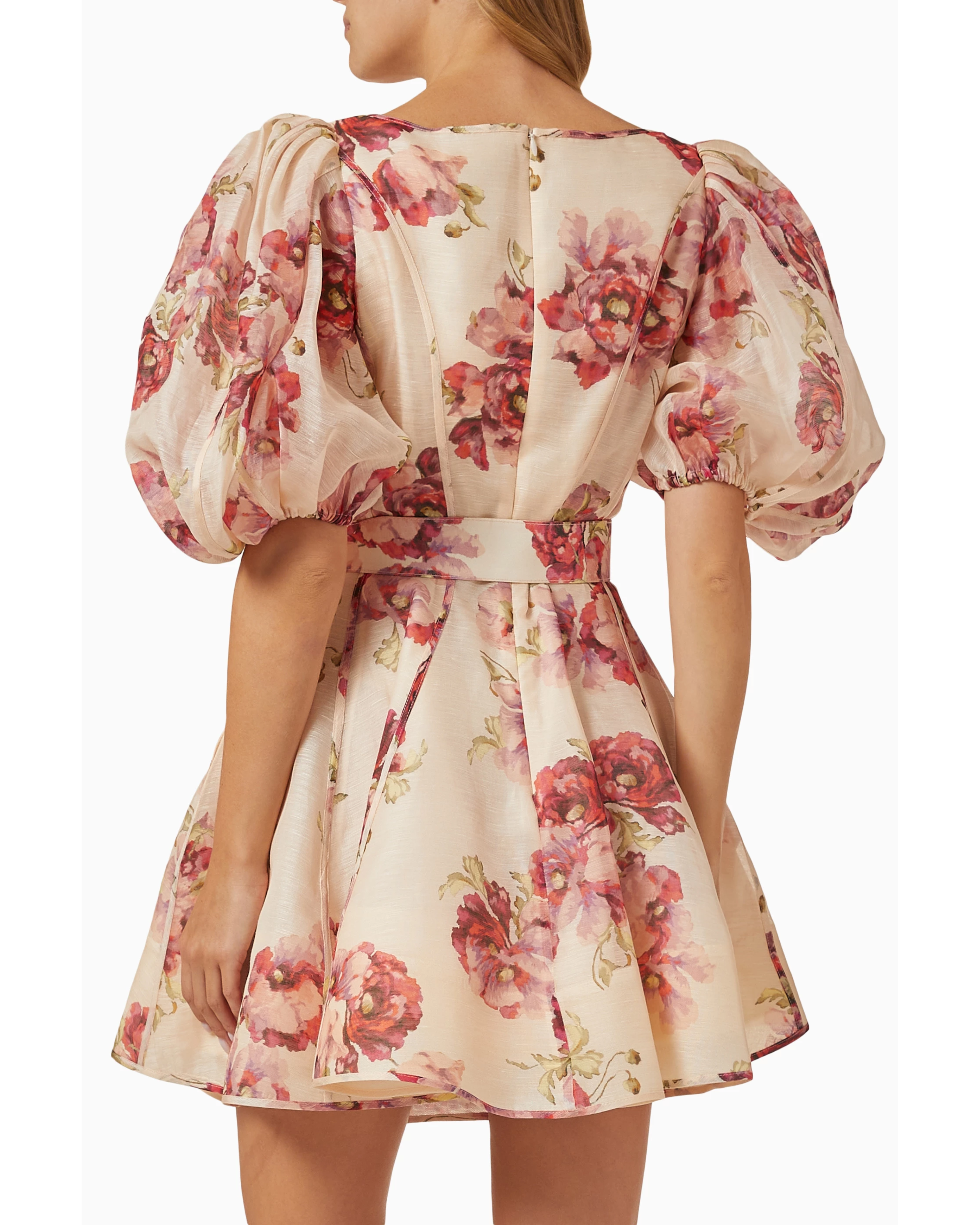 Woman wearing a cream linen mini dress with pink floral print, puff sleeves, and belted waist — ZIMMERMANN | Endless UAE