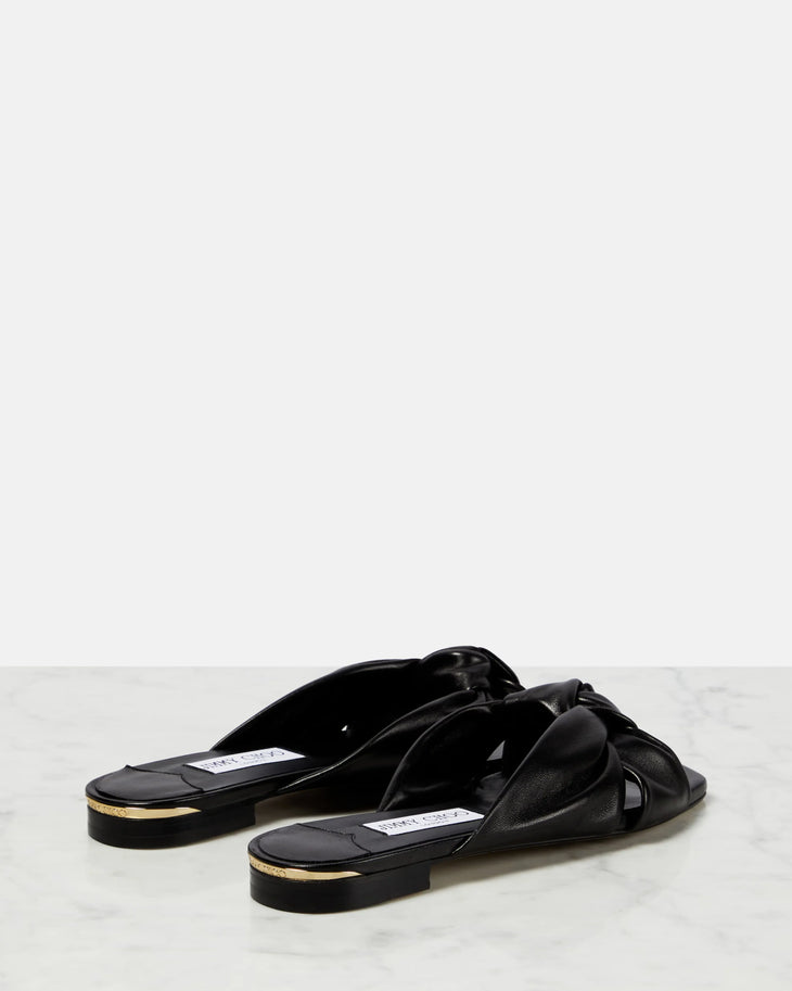 Black leather flat sandals with bow detail — Jimmy Choo | Endless UAE