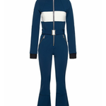Woman wearing navy and white colorblocked ski jumpsuit with belt and black boots — Cordova | Endless UAE
