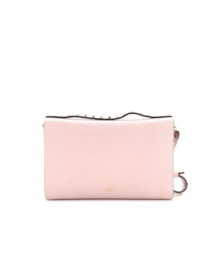 Valentino Garavani pink leather Rockstud crossbody bag with studded trim and flip lock closure — Valentino Garavani | Endless UAE