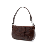Dark brown croc-embossed mini shoulder bag with chain detail held in hand — By Far | Endless UAE