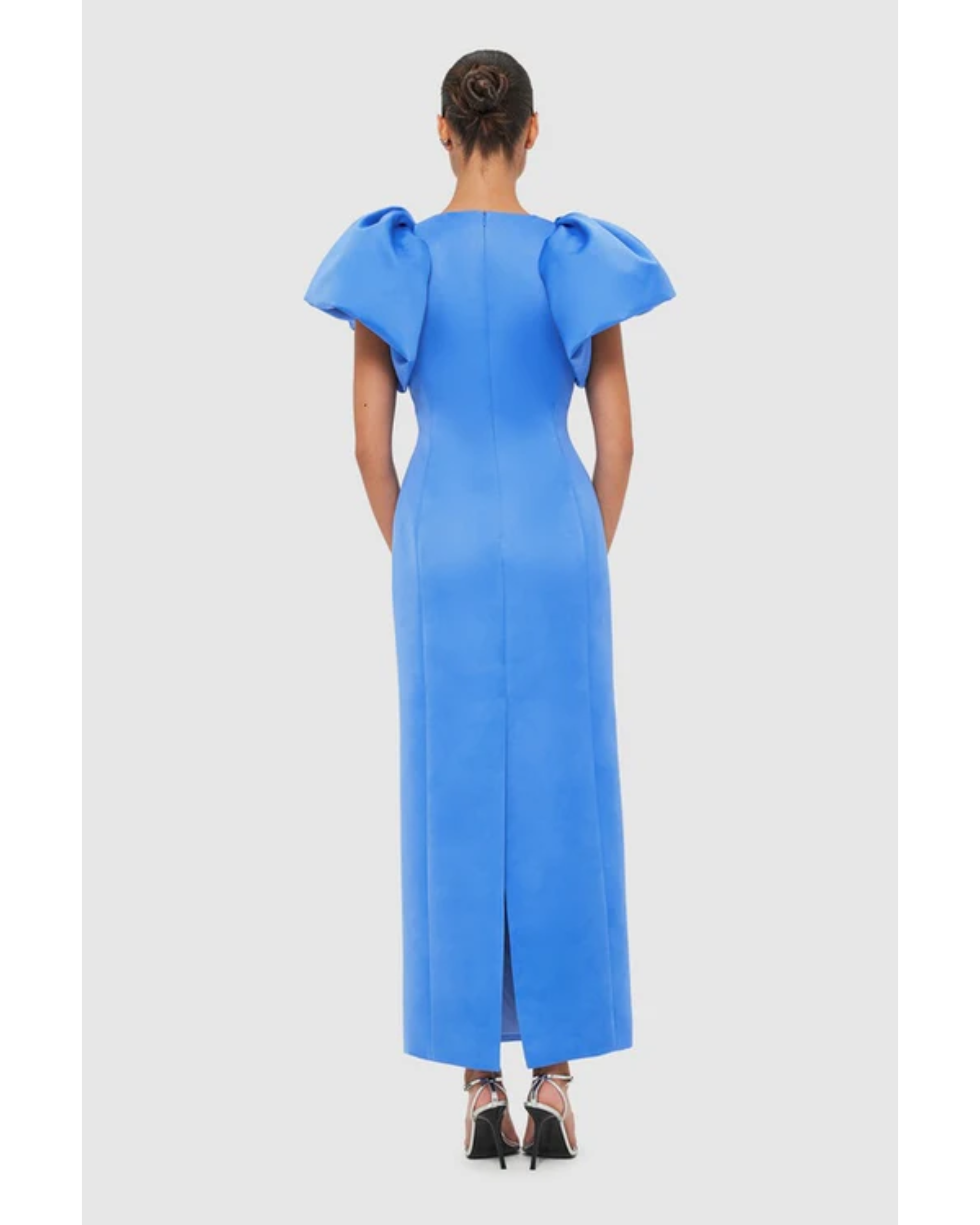Woman wearing steel blue Lucinda Maxi Dress with puffed sleeves, viewed from back — Leo Lin | Endless UAE