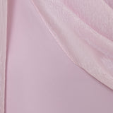 Woman wearing pink textured maxi dress in desert setting — Lichi | Endless UAE