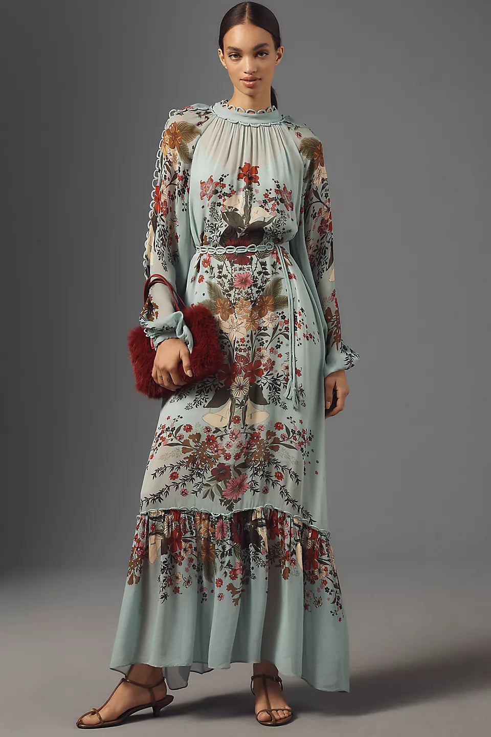 Woman wearing floral print maxi dress with puffed sleeves and burgundy fur clutch — Farm Rio | Endless UAE