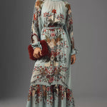 Woman wearing floral print maxi dress with puffed sleeves and burgundy fur clutch — Farm Rio | Endless UAE