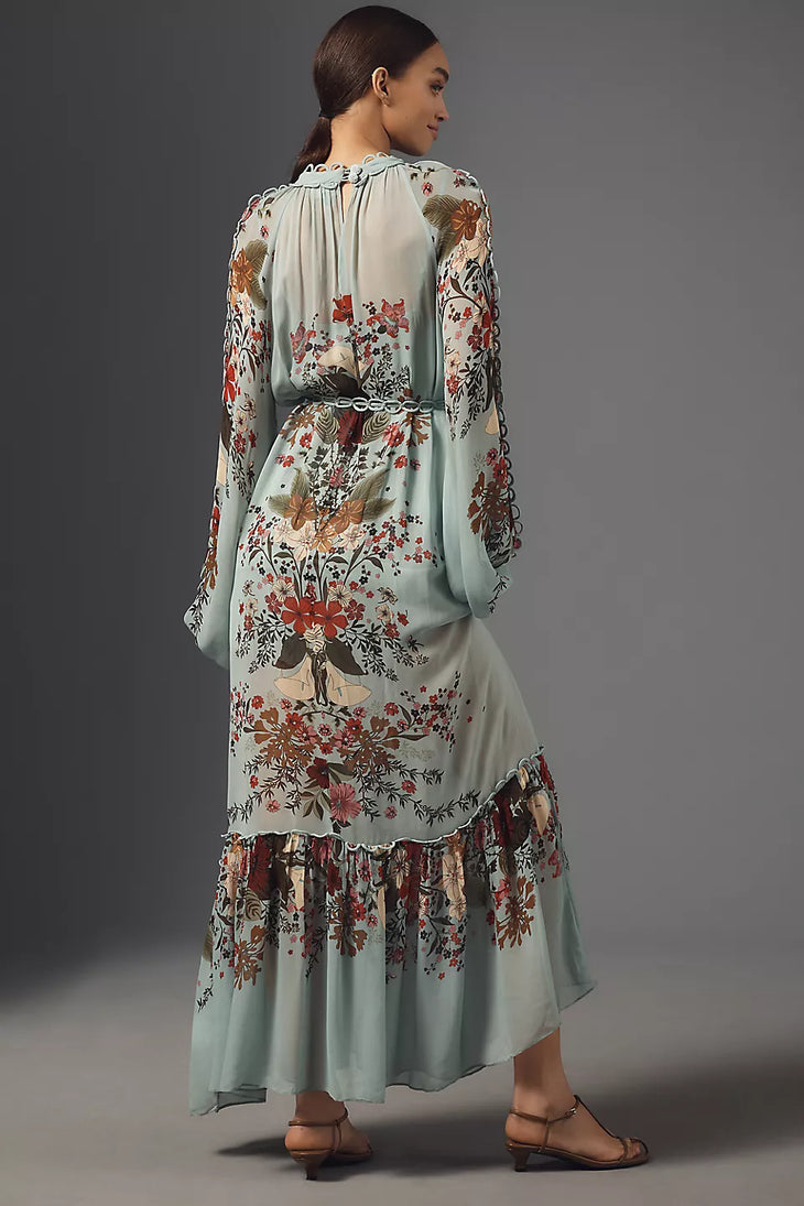 Woman wearing floral print maxi dress with puffed sleeves and burgundy fur clutch — Farm Rio | Endless UAE