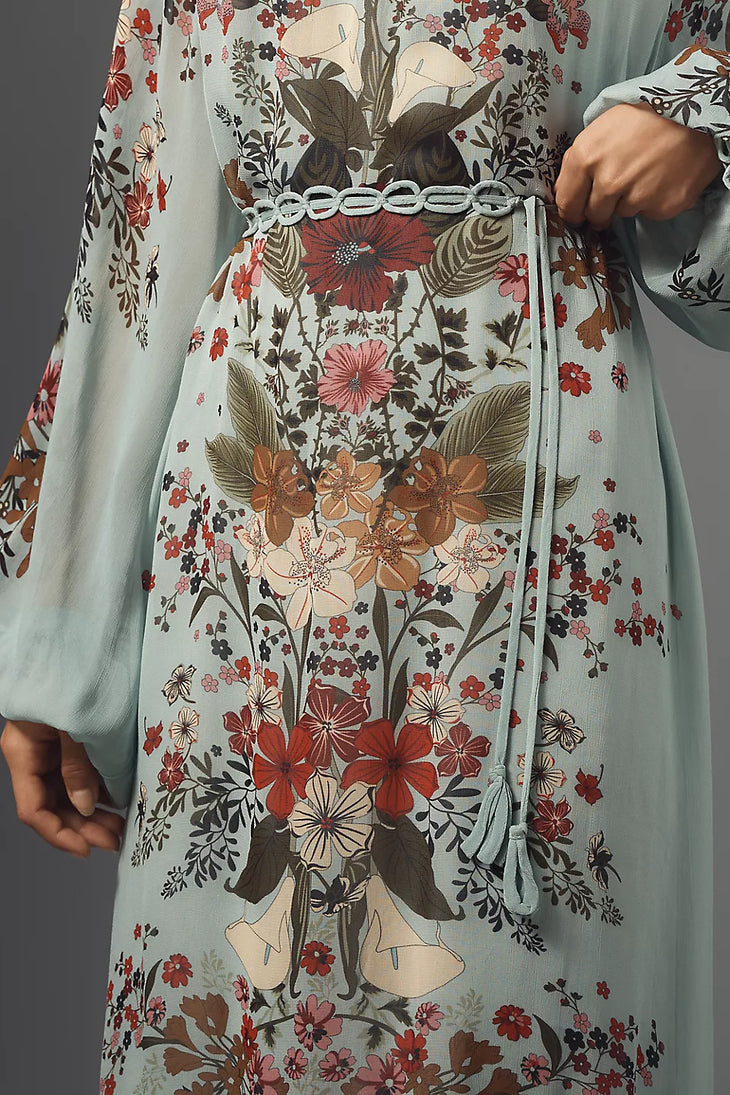 Woman wearing floral print maxi dress with puffed sleeves and burgundy fur clutch — Farm Rio | Endless UAE