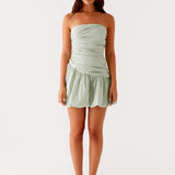 Sage green strapless bubble mini dress with ruched detailing and scalloped hem — Peppermayo | Endless UAE