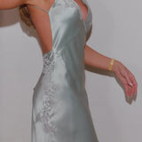 Elegant silver satin backless maxi dress with delicate lace appliqué detailing and adjustable straps — By Keara | Endless UAE