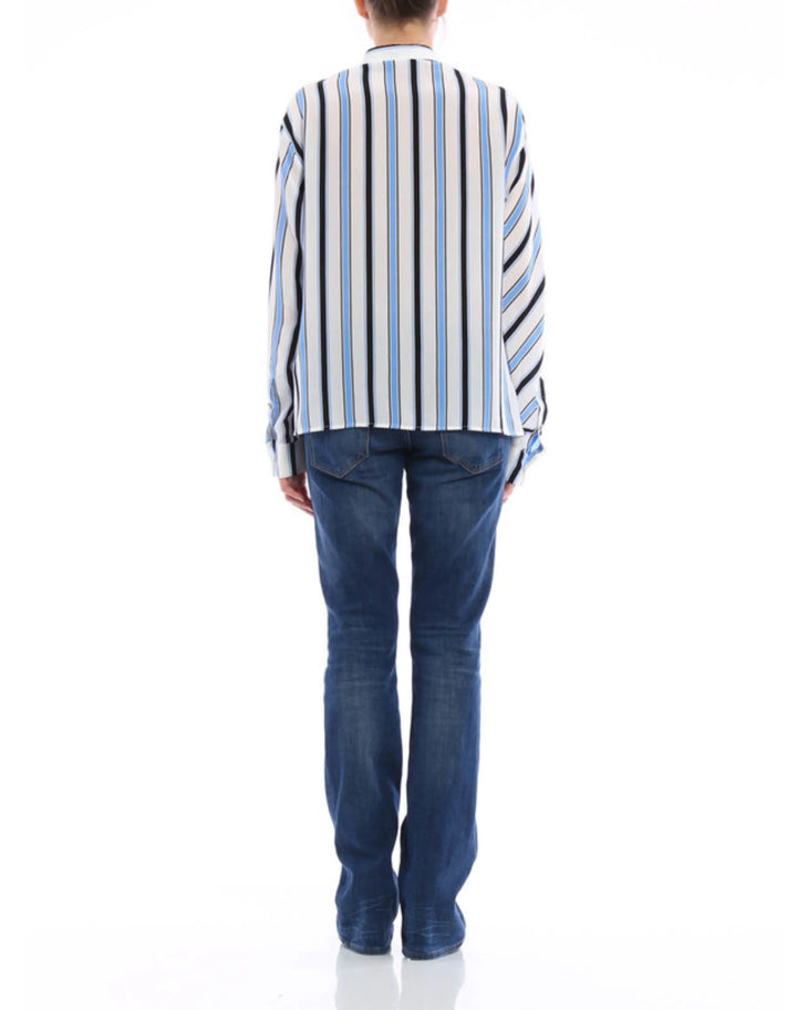 Striped silk shirt with blue, black and white diagonal stripes paired with dark blue jeans — M.S.G.M | Endless UAE