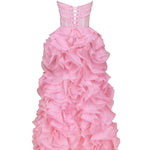 Floor-length pink strapless gown with corset bodice featuring lace-up back detail and dramatic cascading ruffled rosette skirt — Milla | Endless UAE