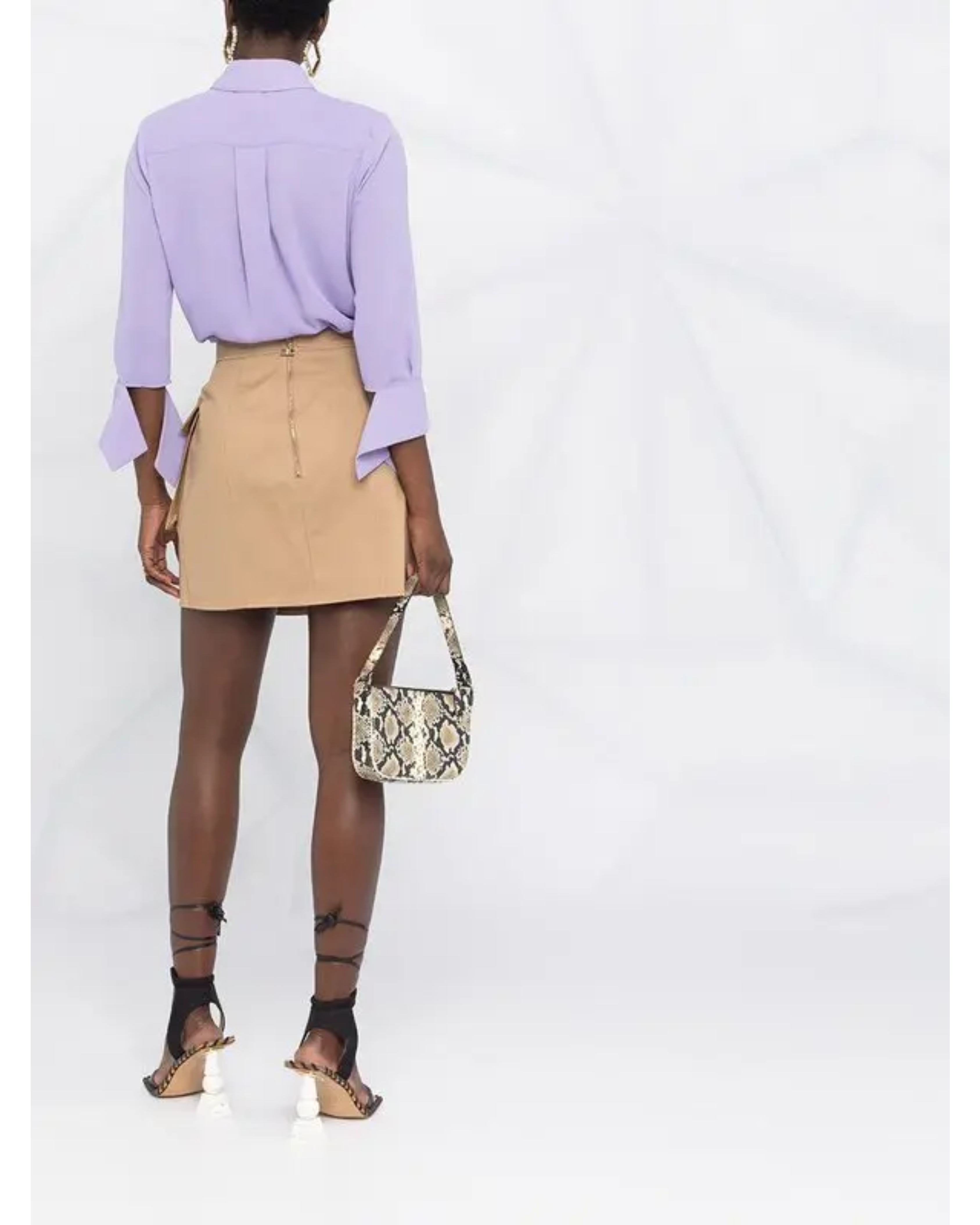 Beige cotton straight short skirt with logo plaque, styled with lavender blouse and snakeskin bag — Elisabetta Franchi | Endless UAE