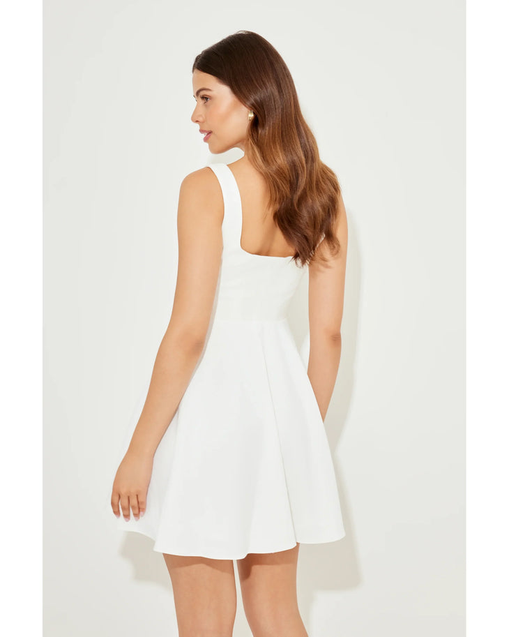 Woman wearing white sleeveless square neck mini dress with white heeled sandals — Odd Muse | Endless UAE