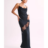 Woman wearing black satin maxi dress with lace side detail and halter neckline — Meshki | Endless UAE