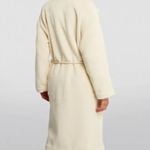 Cream faux fur long coat styled with cream cutout top, black cropped pants and black heels — Anine Bing | Endless UAE