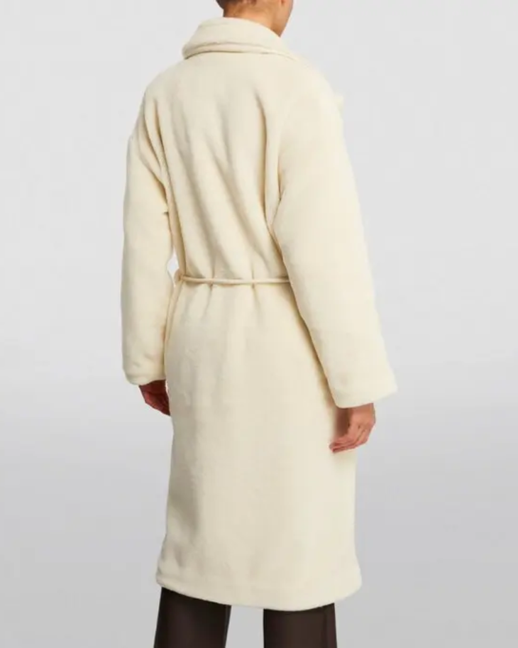 Cream faux fur long coat styled with cream cutout top, black cropped pants and black heels — Anine Bing | Endless UAE