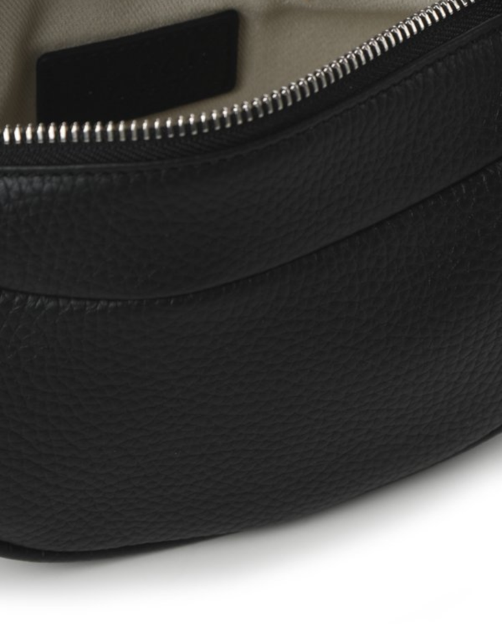 Black leather mini shoulder bag with textured finish held open to show interior — By Far | Endless UAE