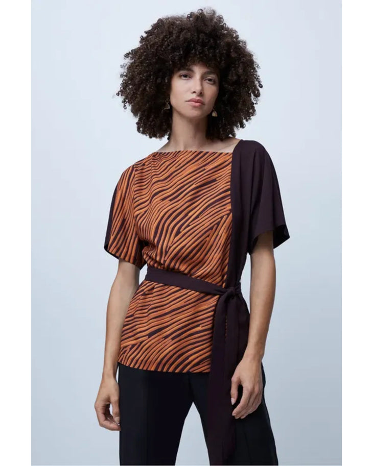 Woman wearing orange zebra stripe top with black sleeves and black cropped pants — French Connection | Endless UAE