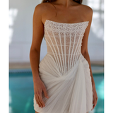 Strapless white mini dress with pearl embellished bodice and draped tulle skirt detail — Rosie Etienne | Endless UAE
