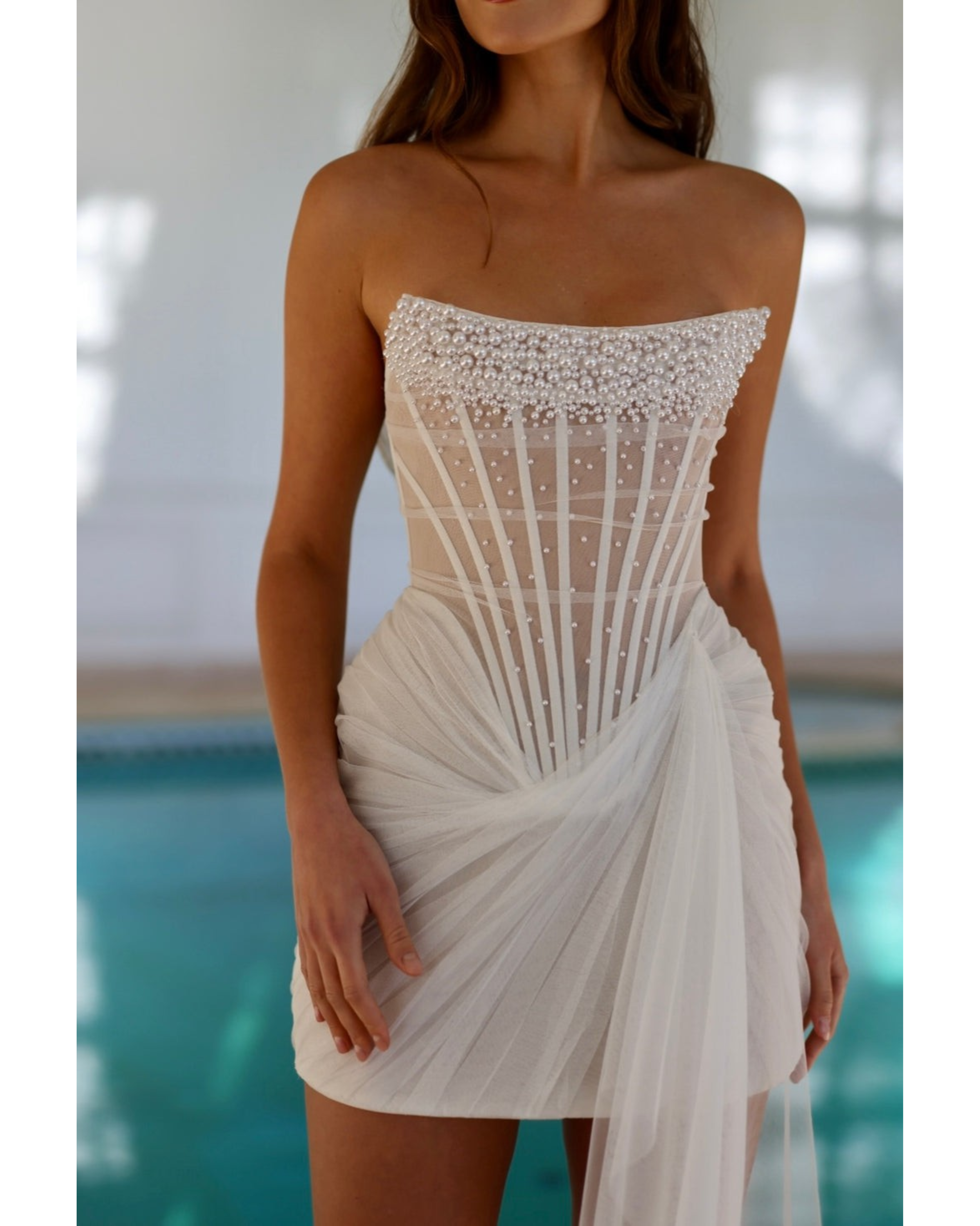 Strapless white mini dress with pearl embellished bodice and draped tulle skirt detail — Rosie Etienne | Endless UAE