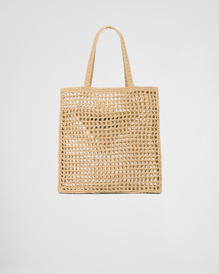 Natural raffia woven tote bag with open crochet pattern and triangle logo detail — Prada | Endless UAE