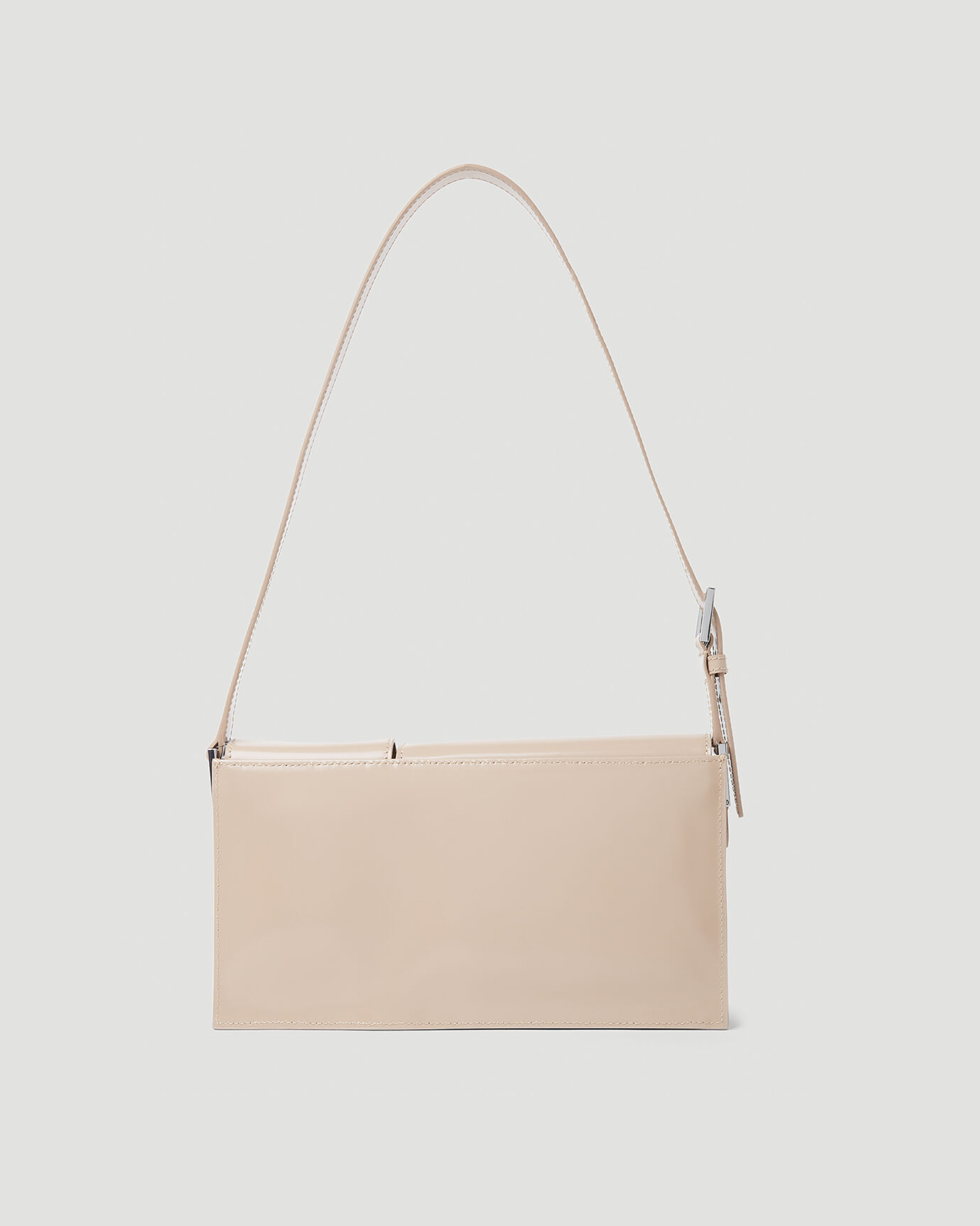 Beige patent leather shoulder bag with dual compartments and silver turnlock closures — Endless | Endless UAE