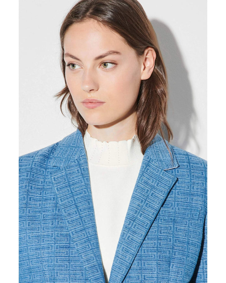 Blue geometric knit blazer worn with white shirt and burgundy boots — Sandro | Endless UAE