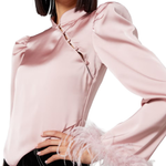 Limousine pink satin top with puffed shoulders and feather cuffs — De La Vali | Endless UAE