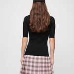 Black knit top with pink plaid wool skirt dress — Maje | Endless UAE