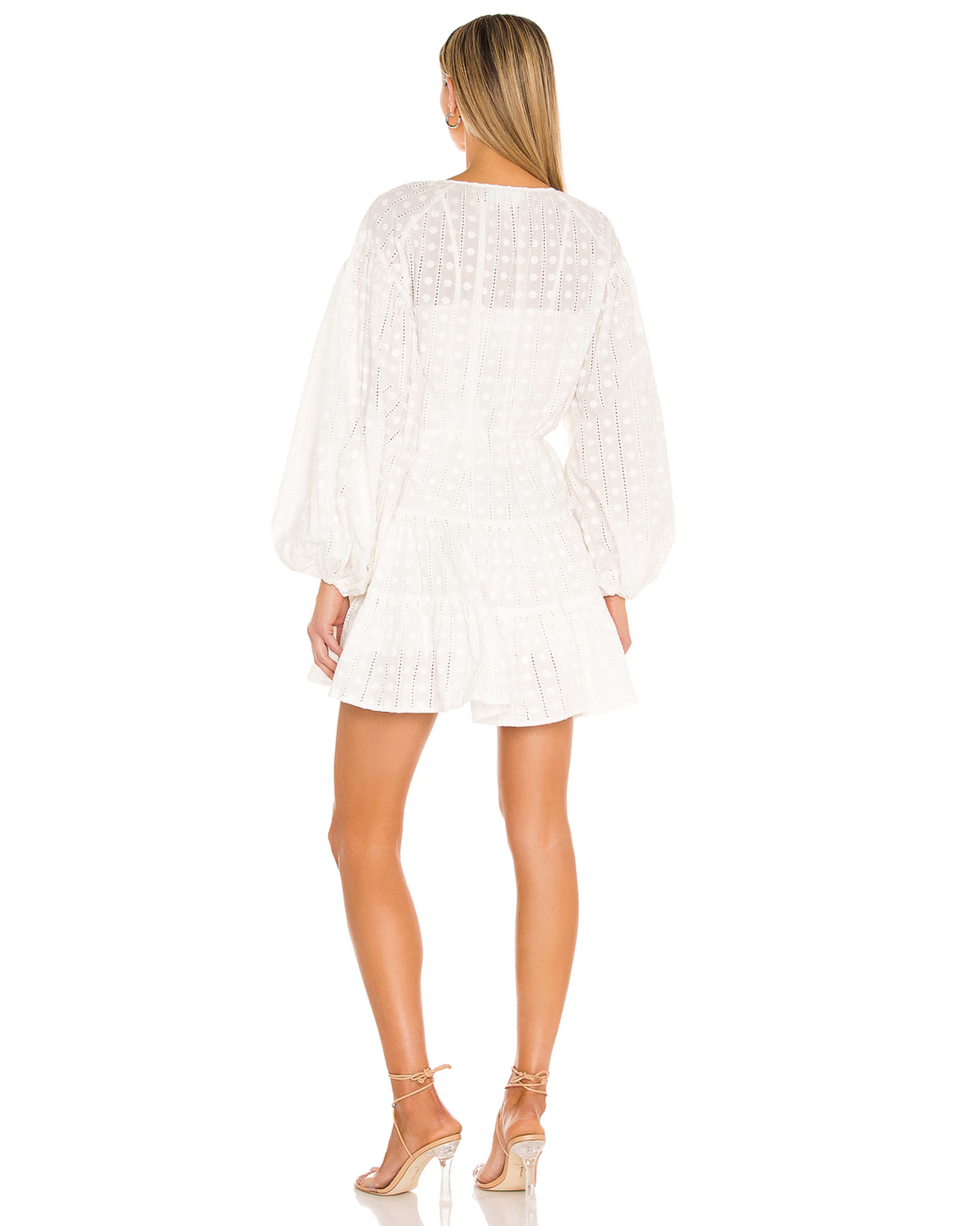 White eyelet mini dress with long blouson sleeves and tiered skirt shown from back — Significant Other | Endless UAE