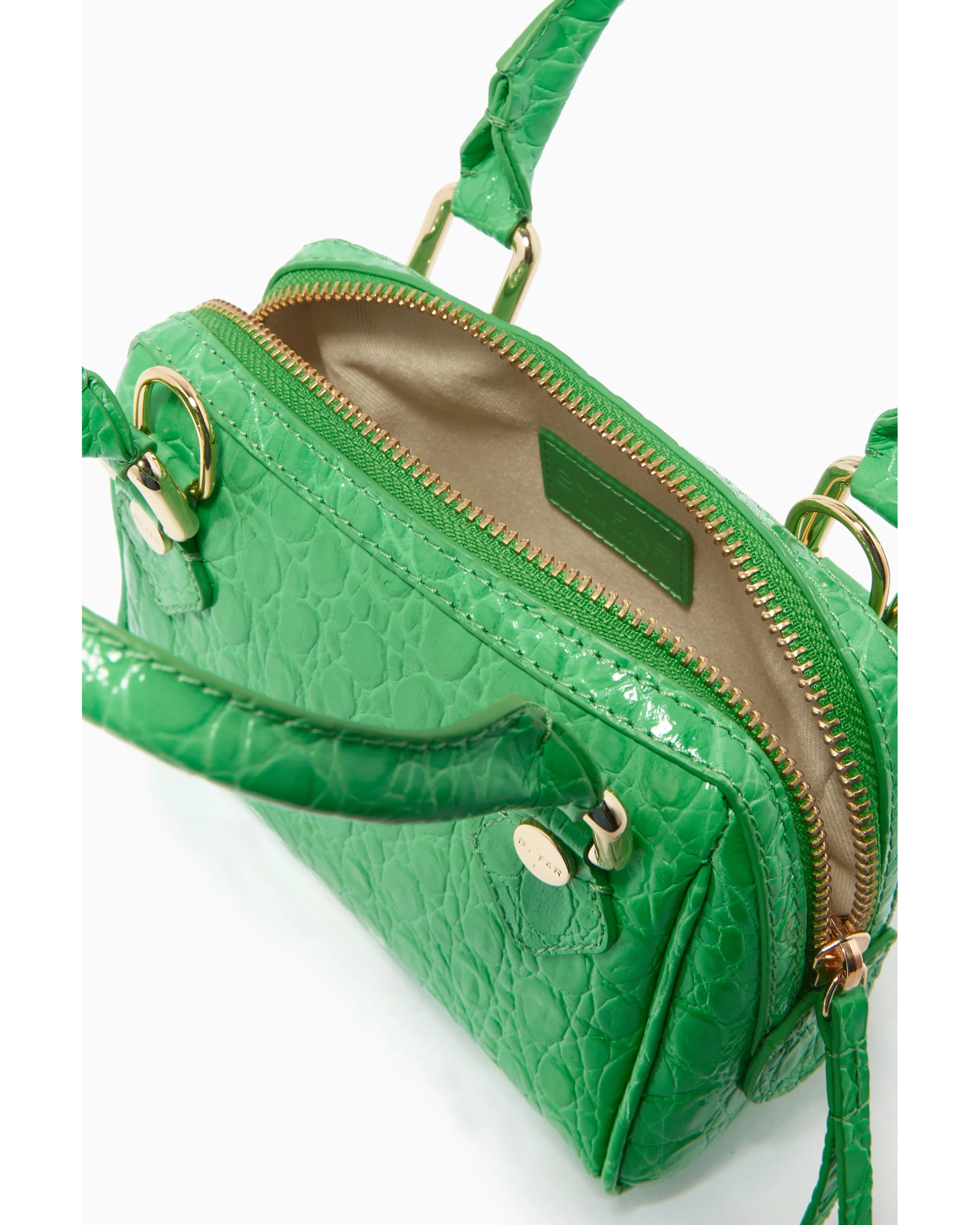 Green crocodile-embossed mini tote bag with gold hardware held by hand — By Far | Endless UAE