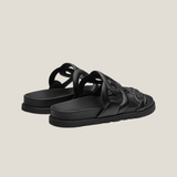Black leather Techno Sandal with cutout straps and flat sole — Hermes | Endless UAE