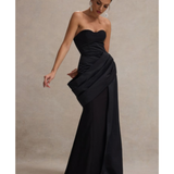 Elegant black strapless corset maxi dress with structured bodice and flowing skirt, styled with statement earrings — Club L London | Endless UAE