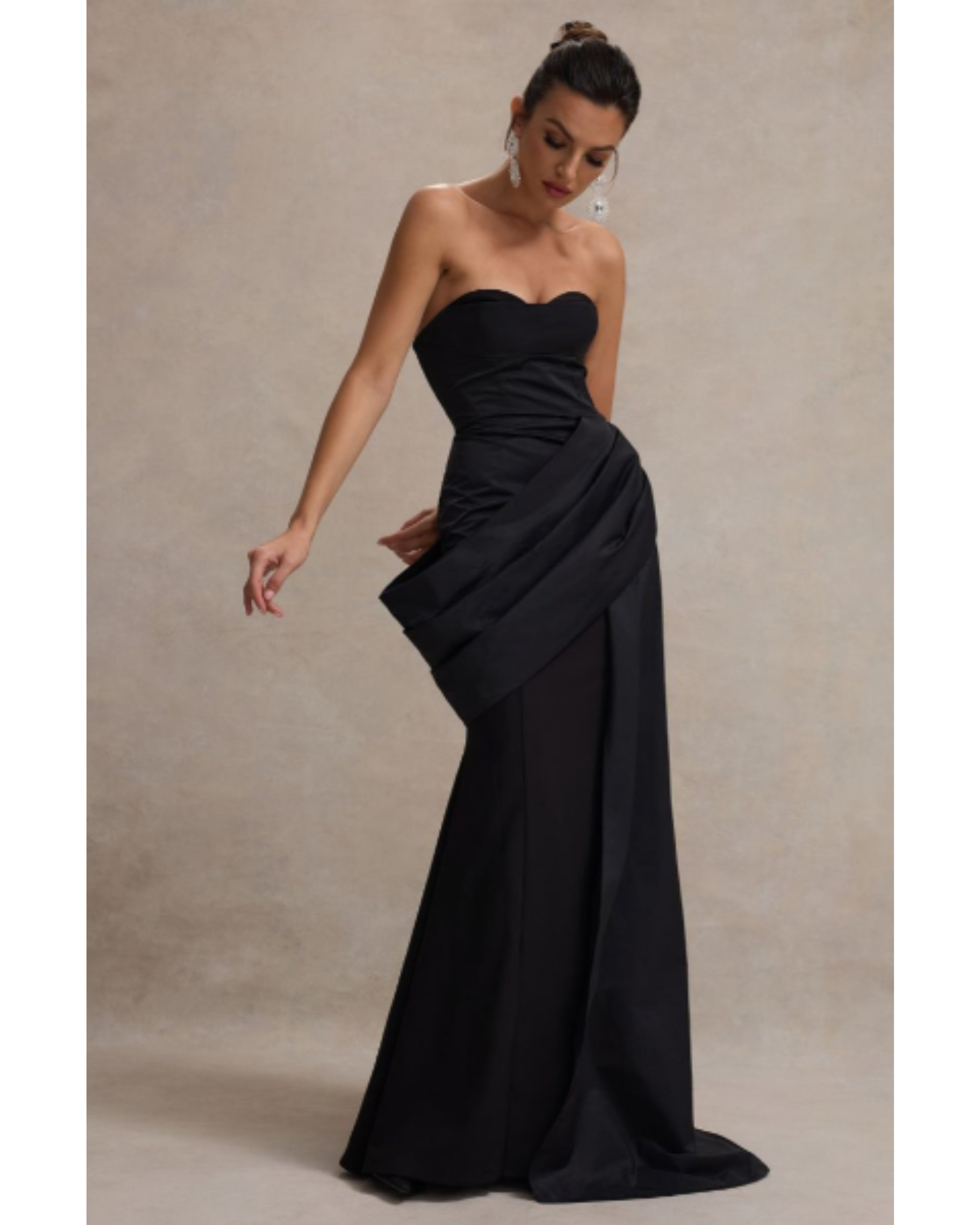 Elegant black strapless corset maxi dress with structured bodice and flowing skirt, styled with statement earrings — Club L London | Endless UAE
