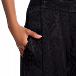 Woman wearing black leopard jacquard blazer and matching wide leg pants with accessories — Farm Rio | Endless UAE