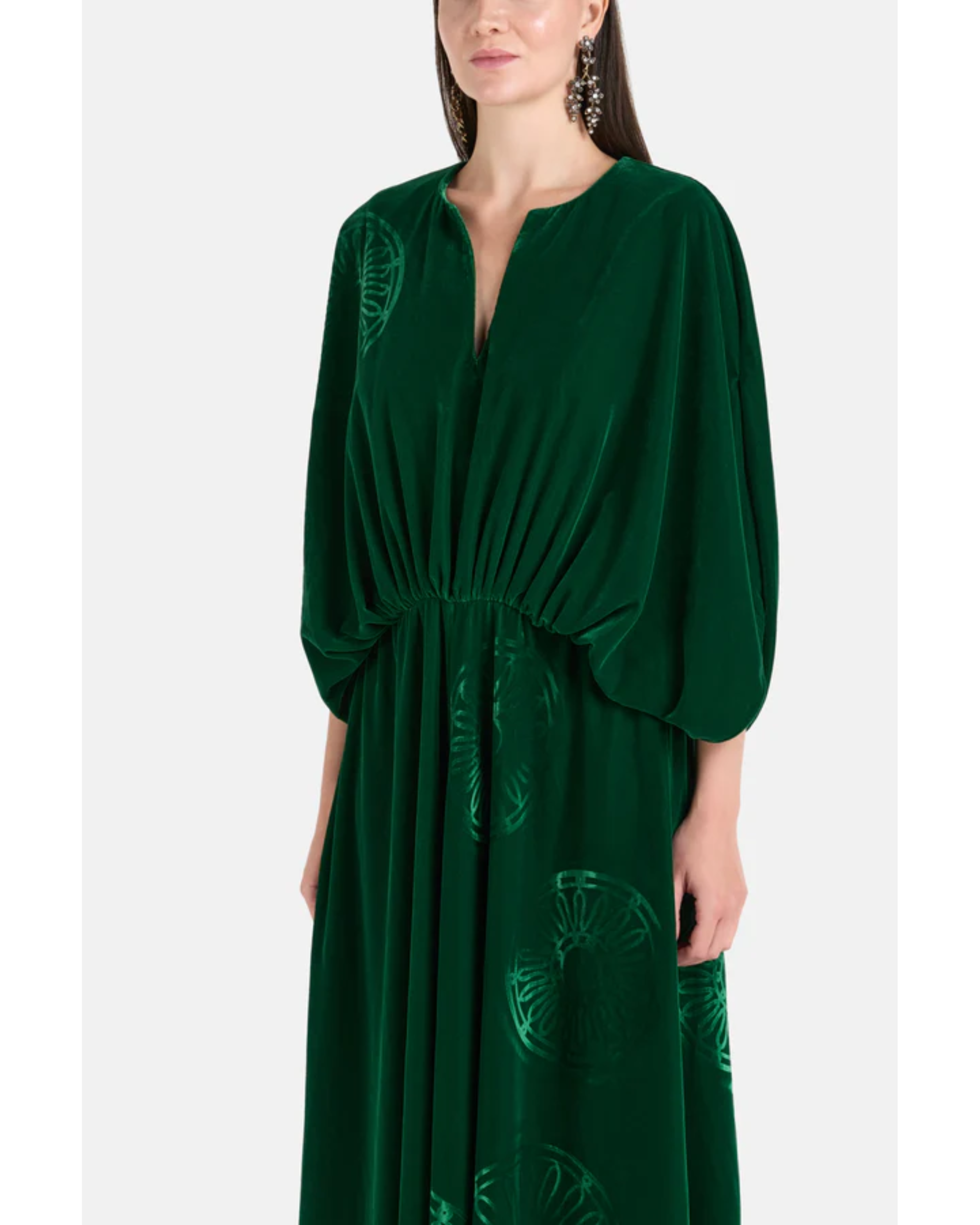 Woman wearing a forest green silk velvet maxi dress with draped sleeves and embroidered details — Themis-Z | Endless UAE