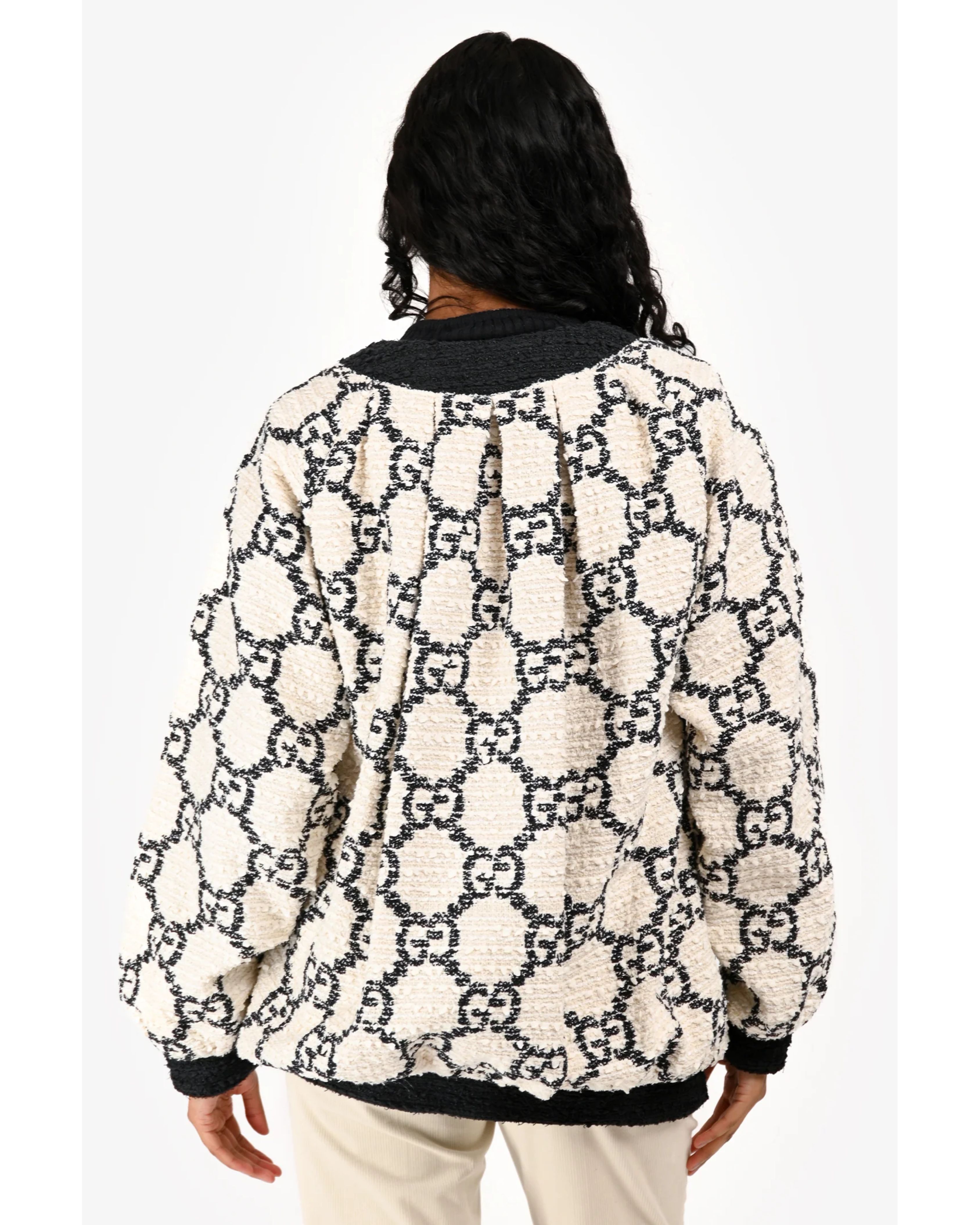 Cream fleece bomber jacket with black GG monogram pattern and black ribbed collar and cuffs, shown from back — Gucci | Endless UAE