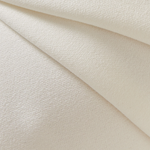 Elegant cream textured fabric with subtle sheen draped in soft folds showing luxurious material detail — Misha | Endless UAE