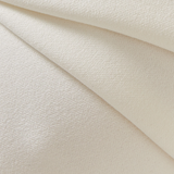 Elegant cream textured fabric with subtle sheen draped in soft folds showing luxurious material detail — Misha | Endless UAE