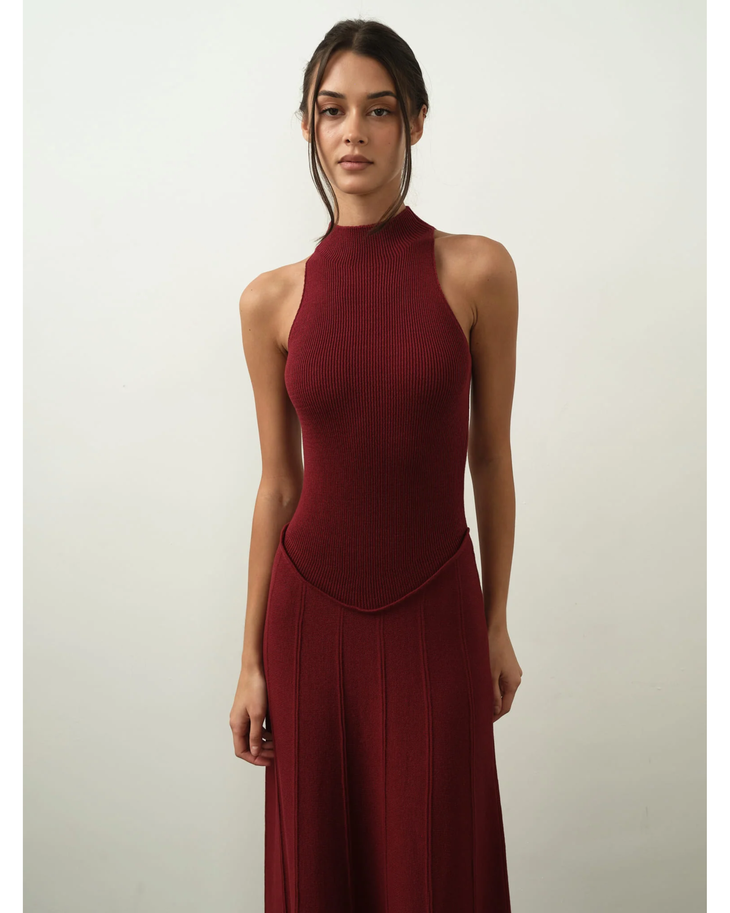 Elegant burgundy ribbed halter maxi dress with form-fitting silhouette and flowy skirt — Nora The Label | Endless UAE