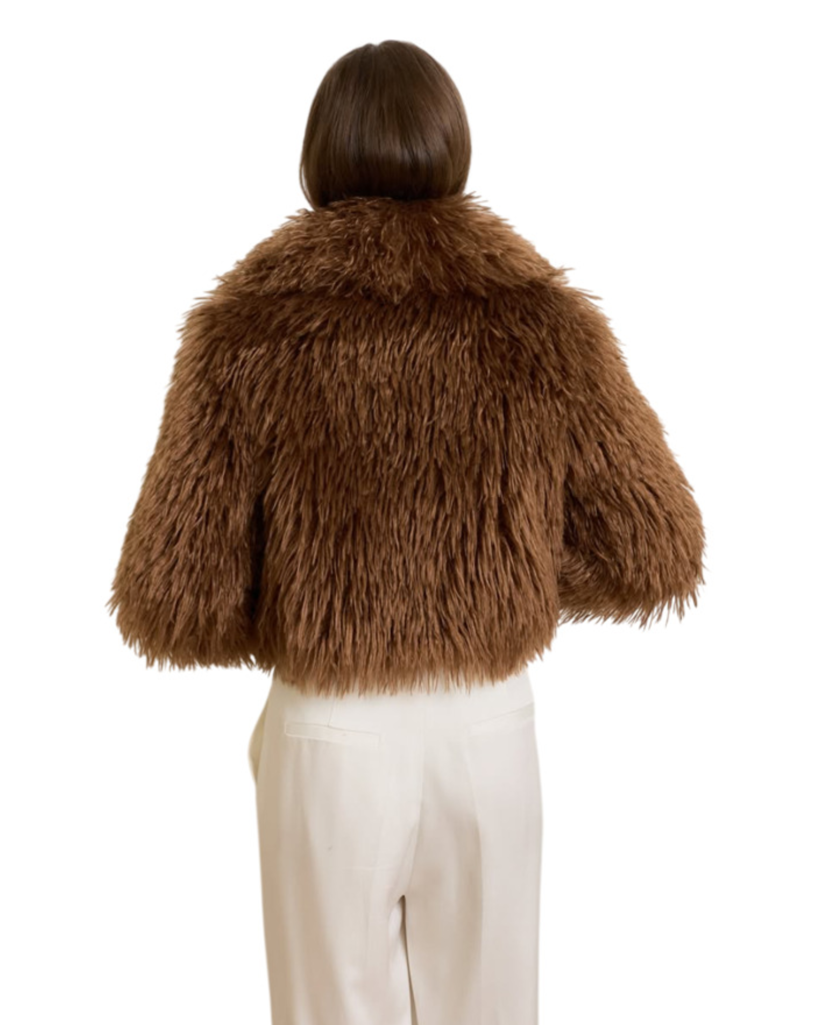 Woman wearing camel-colored fur stole jacket over cream top and pants with burgundy shoes — Madame Magdalena | Endless UAE