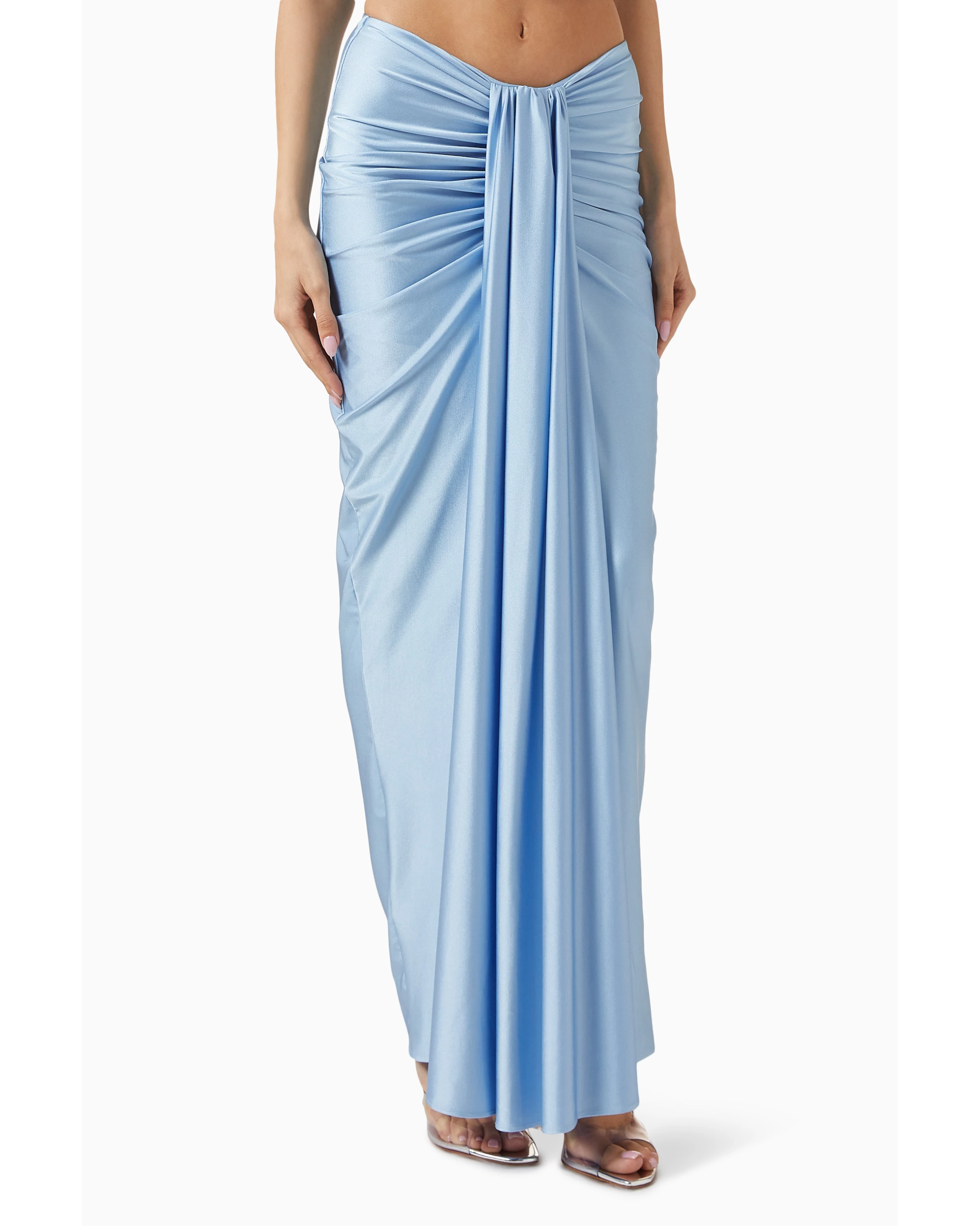 Woman wearing light blue Giselle Maxi Dress with cutout details and white handbag — Baobab | Endless UAE
