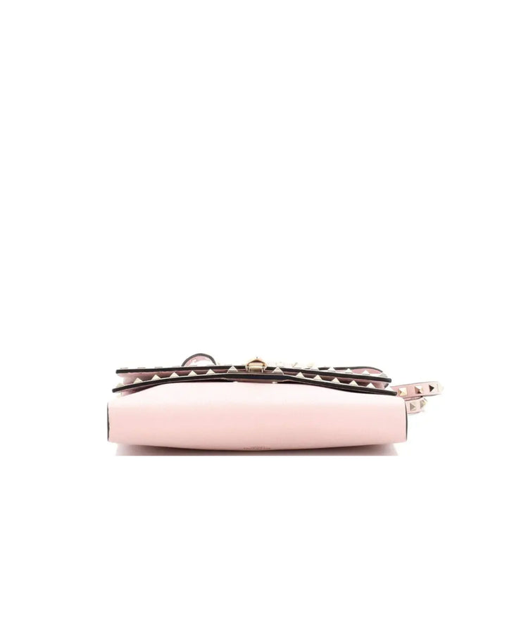 Pink leather Rockstud Flip Lock crossbody bag with studded handle and double flap closure — Valentino Garavani | Endless UAE